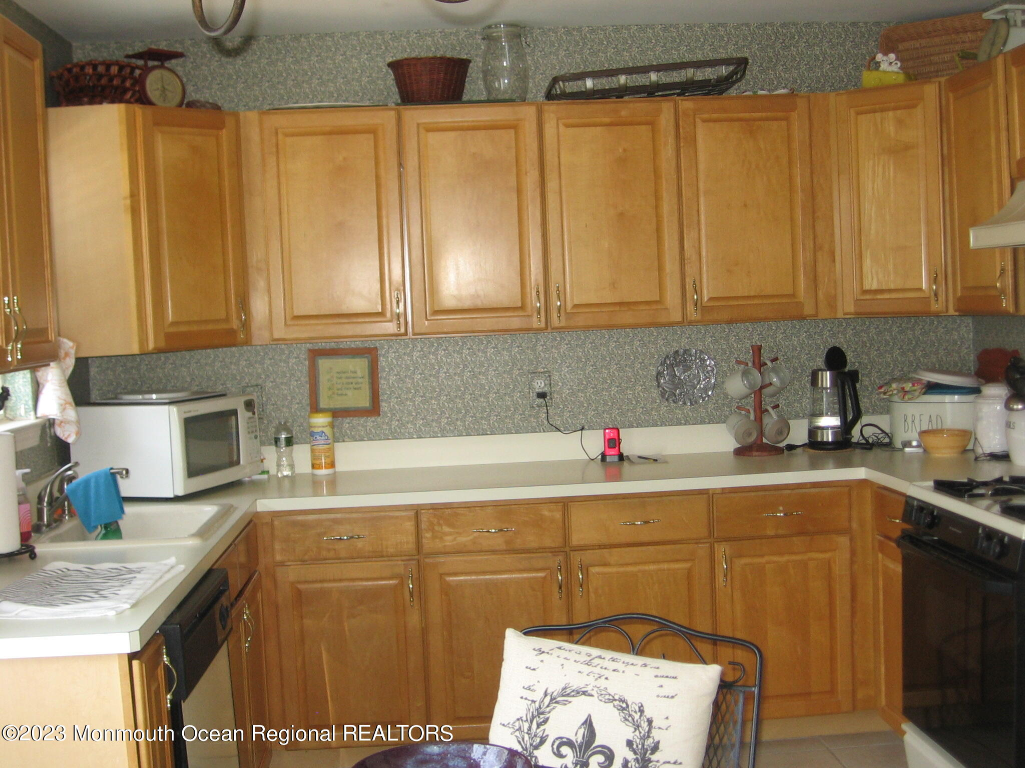 1708 Ridgeview Court, Unit 1708 Parlin, NJ 08859 - Photo 3 of 25 a kitchen with a sink a cabinets and appliances
