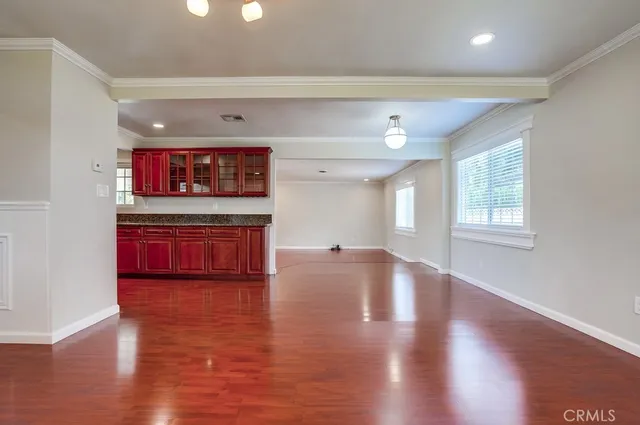 a open kitchen with stainless steel appliances granite countertop a stove and a sink