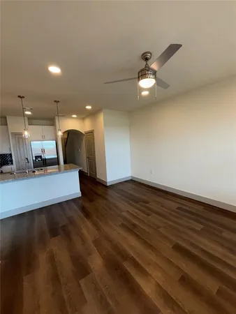 a view of a kitchen with a sink and a floor to ceiling window