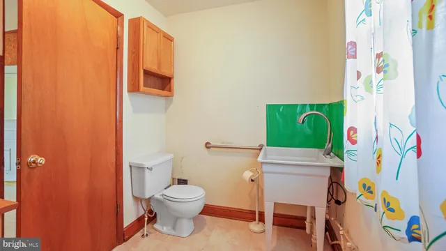 a bathroom with a toilet and a sink