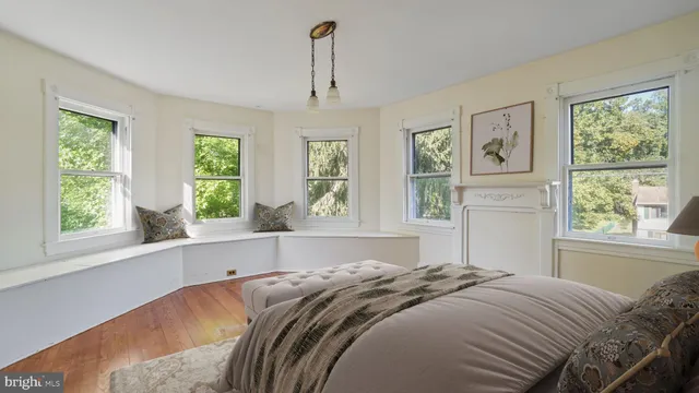 a bedroom with a large bed and a window