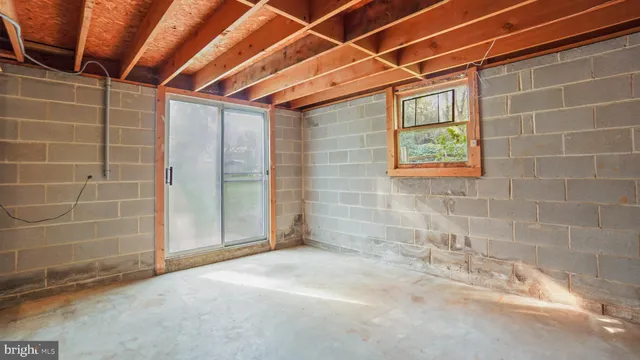 a view of empty room with windows