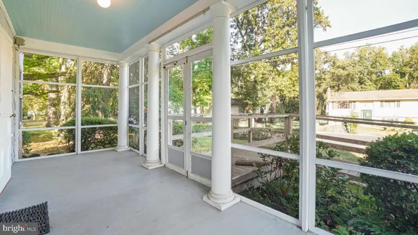 a view of a room with large windows