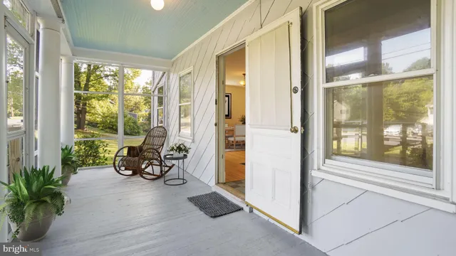 a living room with furniture and windows