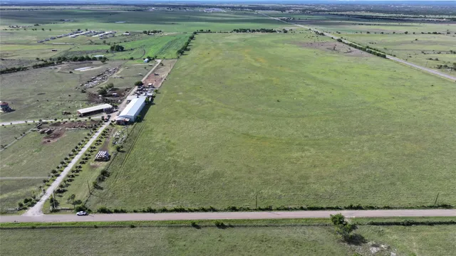 a view of a big yard with an outdoor space