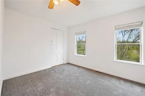an empty room with windows