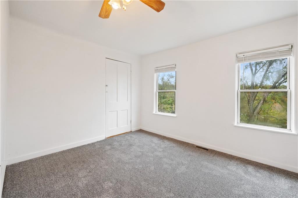 701 Maple Way Oakmont, PA 15139 - Photo 11 of 26 an empty room with windows