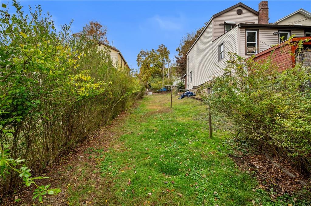 701 Maple Way Oakmont, PA 15139 - Photo 17 of 26 a backyard of a house with lots of green space