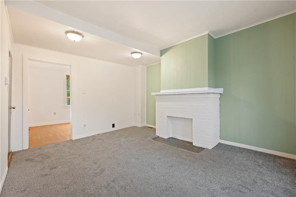 701 Maple Way Oakmont, PA 15139 - Photo 10 of 26 a view of an empty room with a fireplace