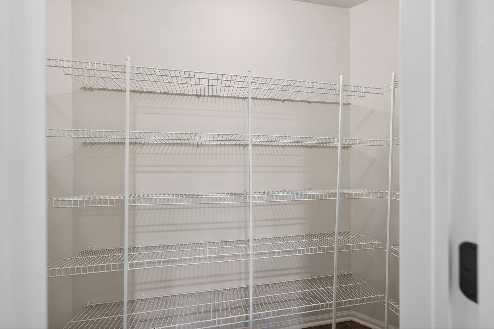 802 Butternut Lane, Unit C Mount Prospect, IL 60056 - Photo 14 of 36 a view of a room with racks on the wall