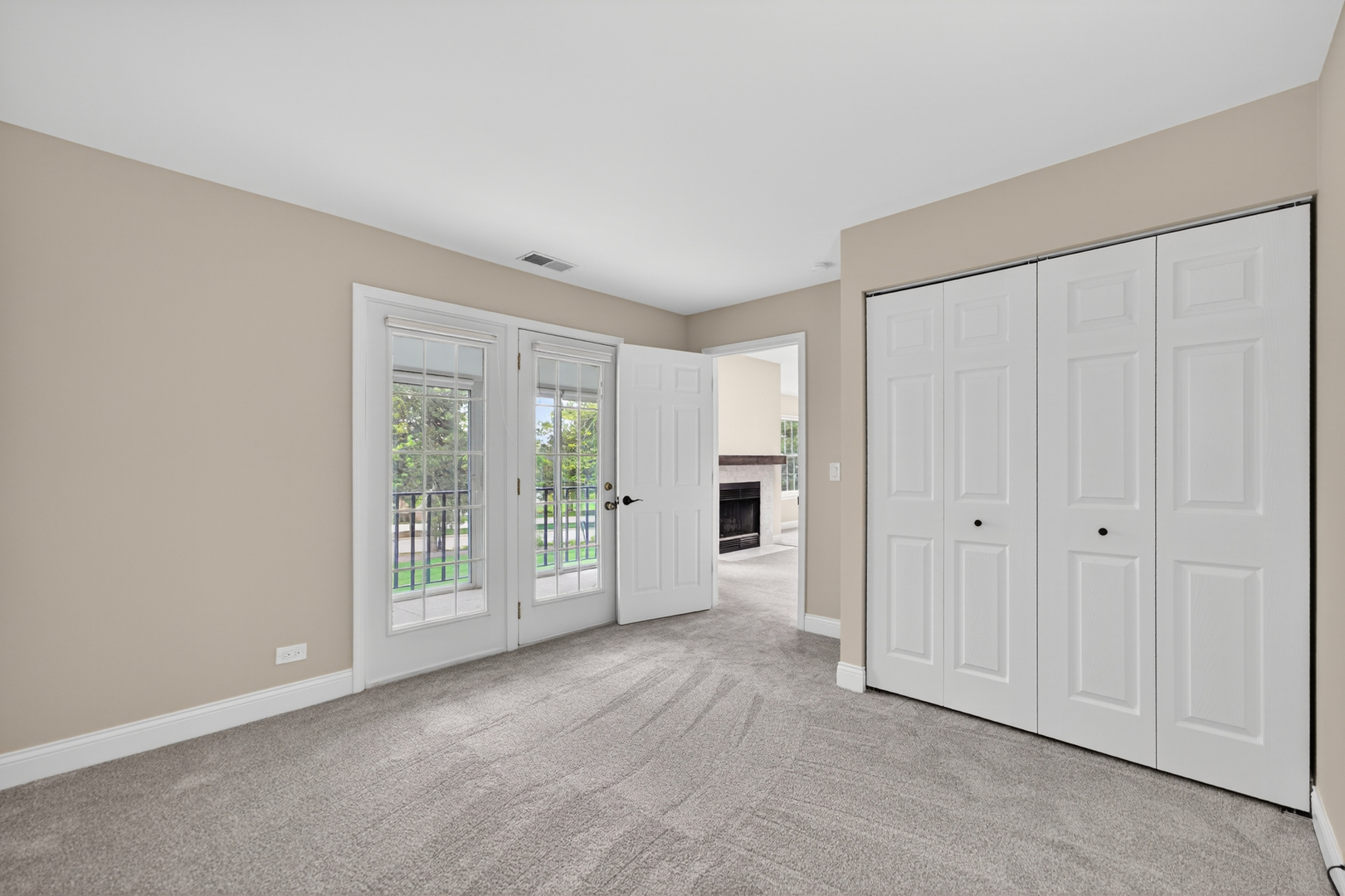 802 Butternut Lane, Unit C Mount Prospect, IL 60056 - Photo 17 of 36 a view of an empty room with a window