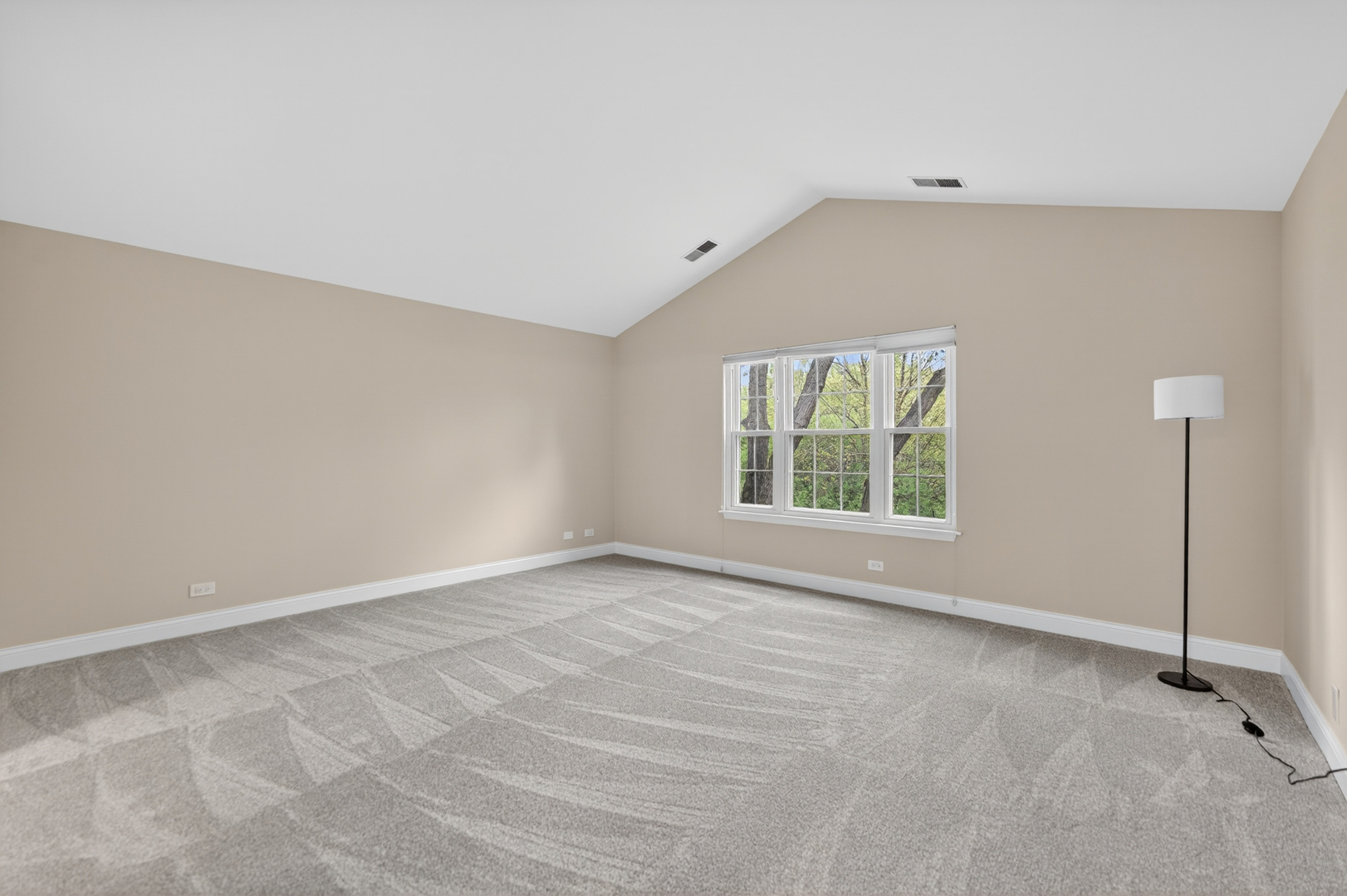 802 Butternut Lane, Unit C Mount Prospect, IL 60056 - Photo 23 of 36 a view of an empty room with a window
