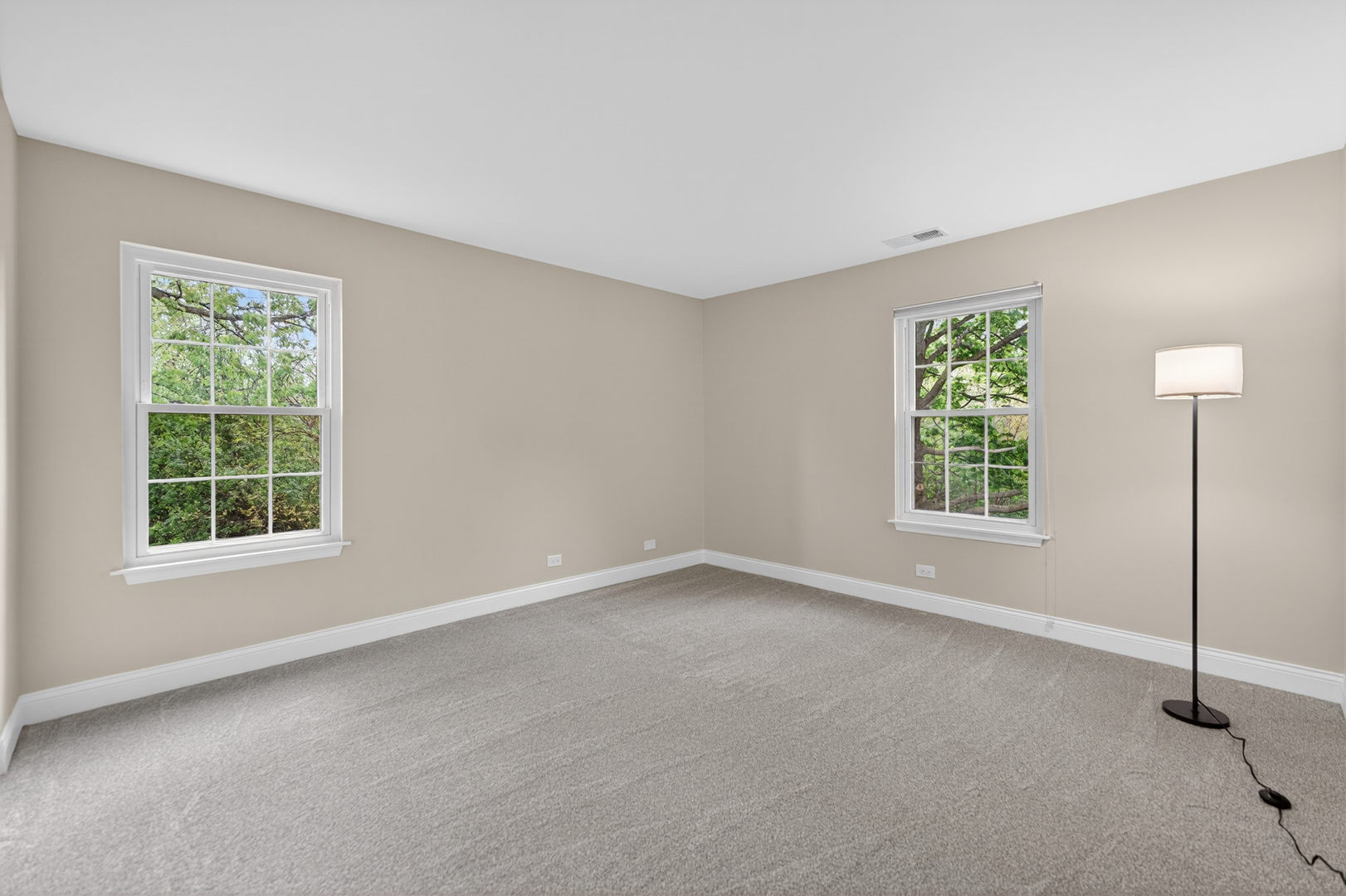 802 Butternut Lane, Unit C Mount Prospect, IL 60056 - Photo 29 of 36 an empty room with windows