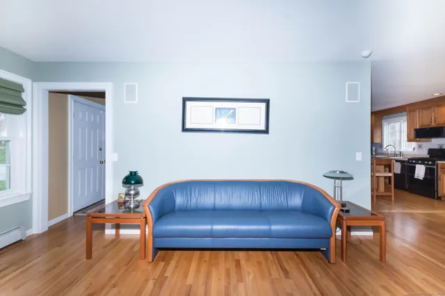 a room with a chair and wooden floor