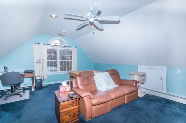 a living room with furniture and a window