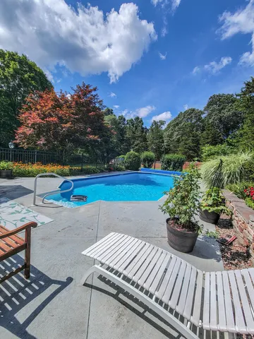 a view of a backyard with sitting area
