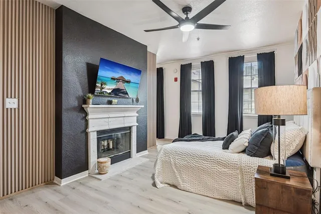 a bedroom with furniture and a fireplace