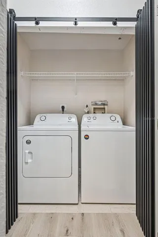 a utility room with dryer and washer