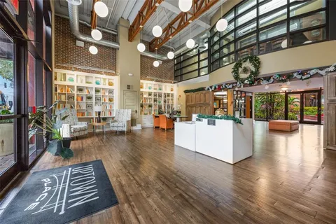 a kitchen with stainless steel appliances granite countertop a refrigerator and a stove