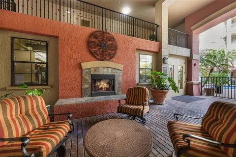 a view of a swimming pool with outdoor seating