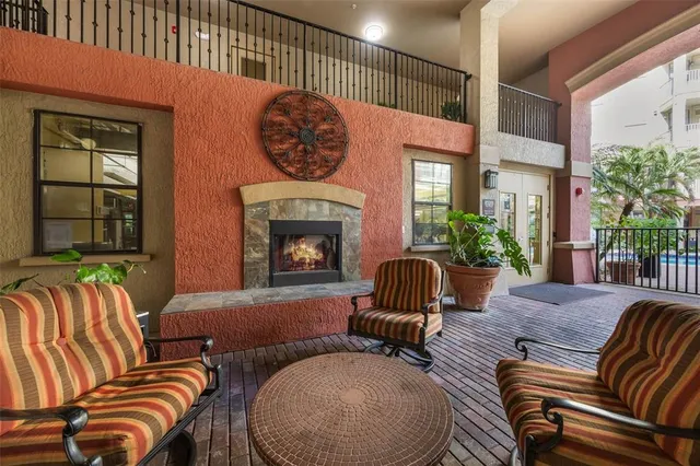 a view of a swimming pool with outdoor seating