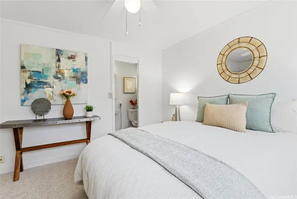 a bedroom with a bed and a dresser