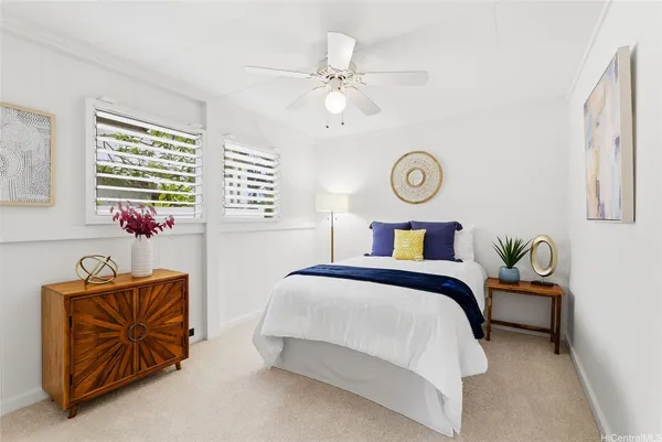 a bedroom with a bed and dresser