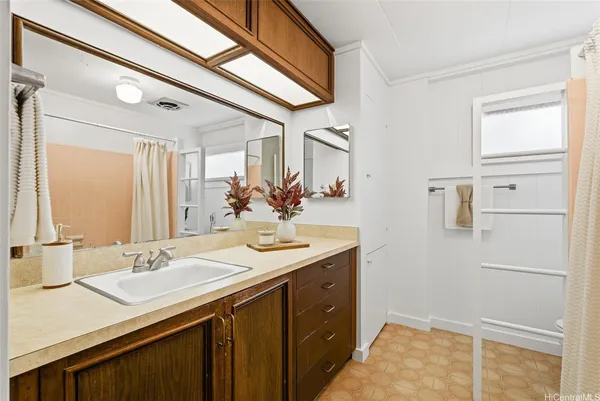 a bathroom with a sink and a mirror