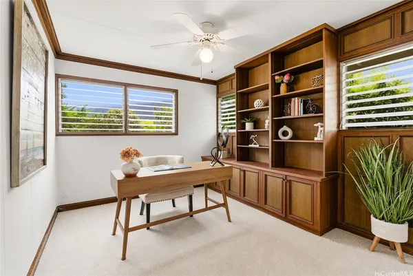 a view of a workspace with furniture
