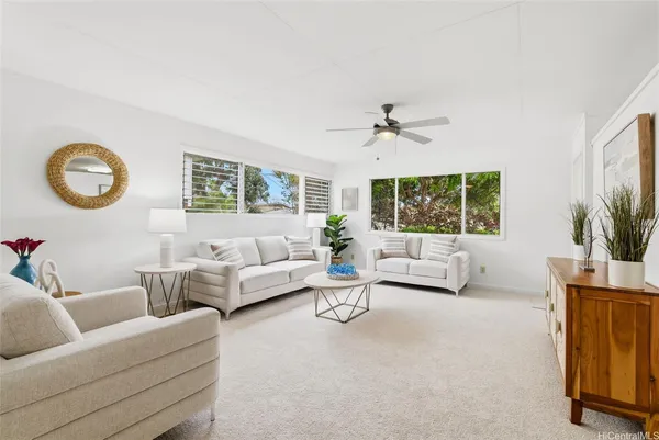 a living room with furniture and a large window