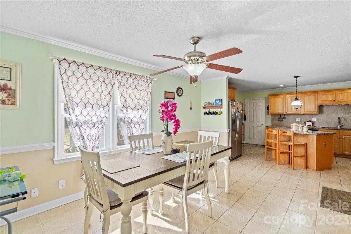 1429 Ebinport Road Rock Hill, SC 29732 - Photo 14 of 30 a view of a dining room with furniture and a chandelier