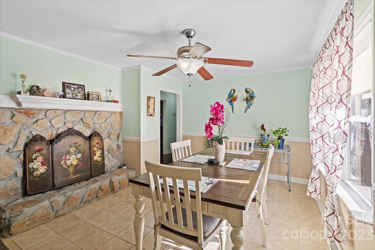 1429 Ebinport Road Rock Hill, SC 29732 - Photo 15 of 30 a view of a dining room with furniture wooden floor and fan