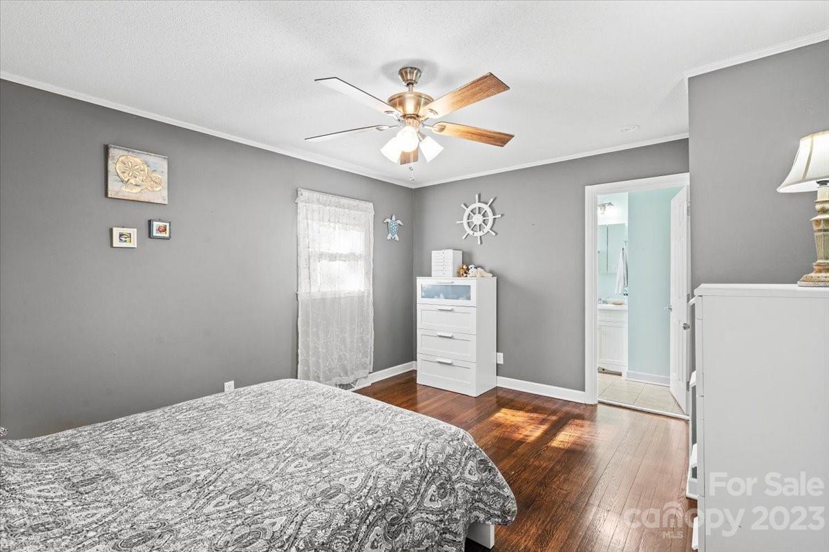 1429 Ebinport Road Rock Hill, SC 29732 - Photo 21 of 30 a bedroom with a bed and a chandelier