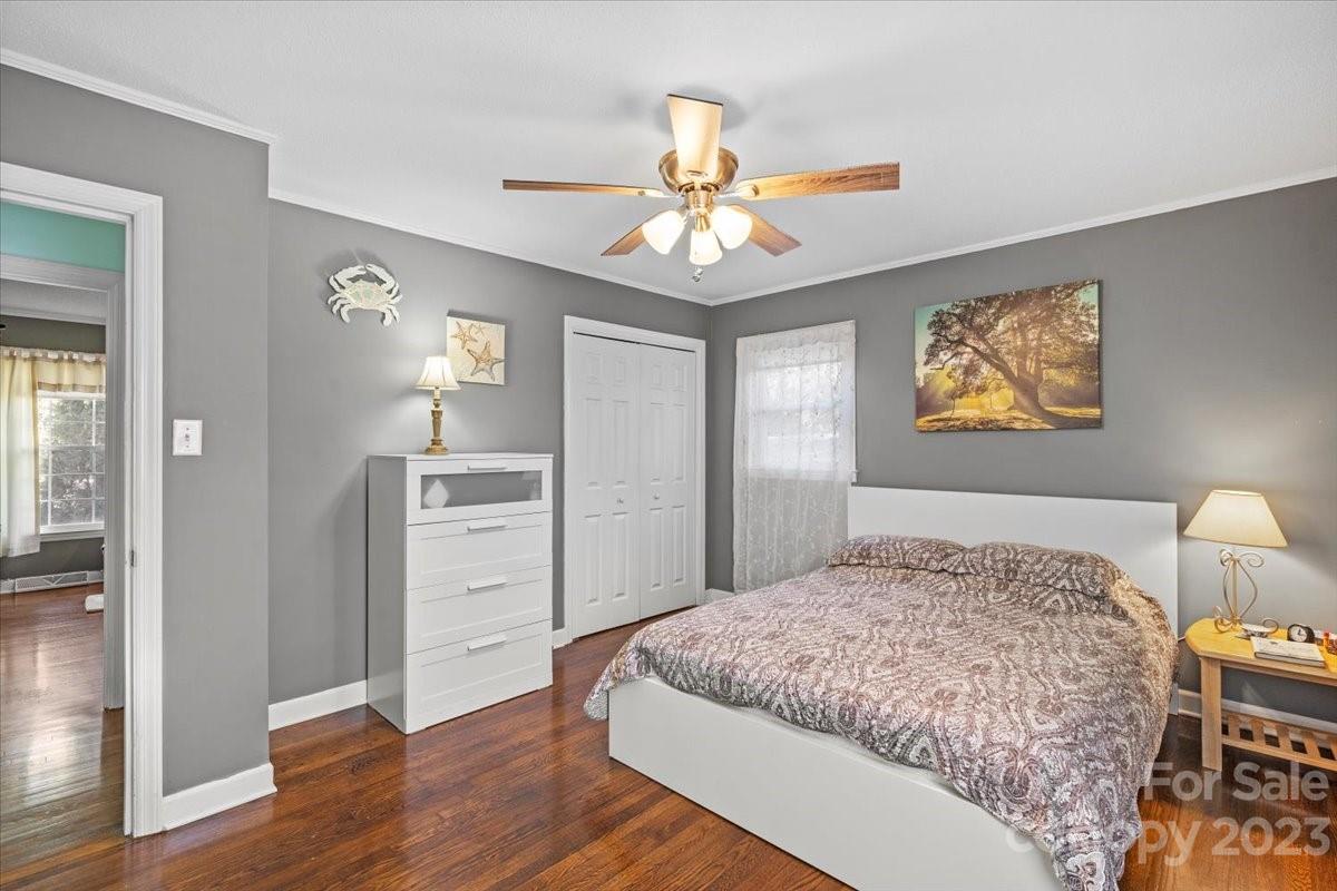 1429 Ebinport Road Rock Hill, SC 29732 - Photo 22 of 30 a bedroom with a bed and a chandelier