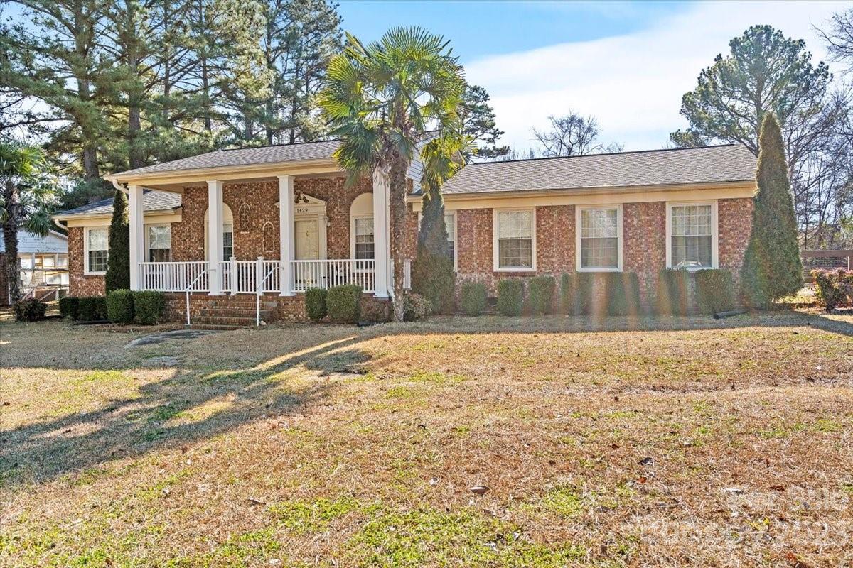 1429 Ebinport Road Rock Hill, SC 29732 - Photo 3 of 30 a front view of a house with a yard and trees