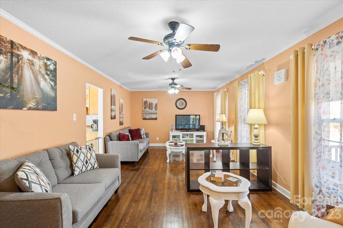 1429 Ebinport Road Rock Hill, SC 29732 - Photo 6 of 30 a living room with furniture a chandelier and a table