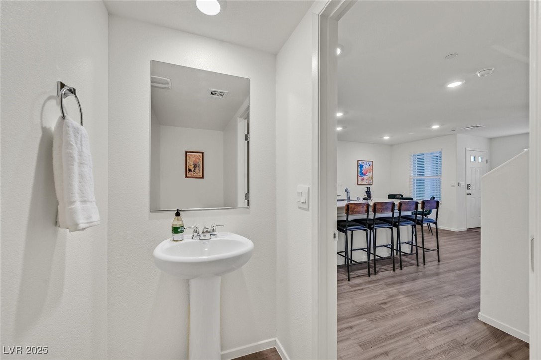 1906 Arietta Vista Street Henderson, NV 89044 - Photo 11 of 25 Bathroom featuring wood finished floors and recess