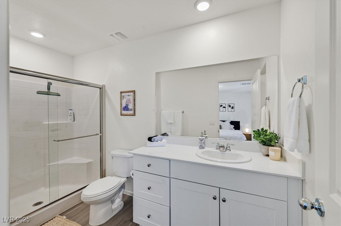 1906 Arietta Vista Street Henderson, NV 89044 - Photo 16 of 25 Ensuite bathroom featuring vanity, a shower stall,