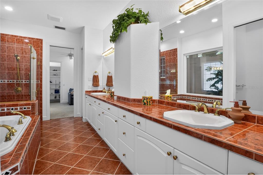 2968 Plantation Road Winter Haven, FL 33884 - Photo 31 of 81 a spacious bathroom with a double vanity sink mirror and double