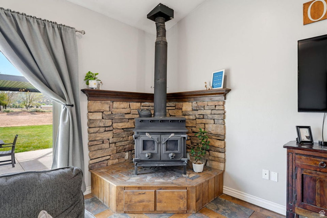 7776 Wagon Road East St. George, UT 84770 - Photo 10 of 76 Detailed view of baseboards and a wood stove
