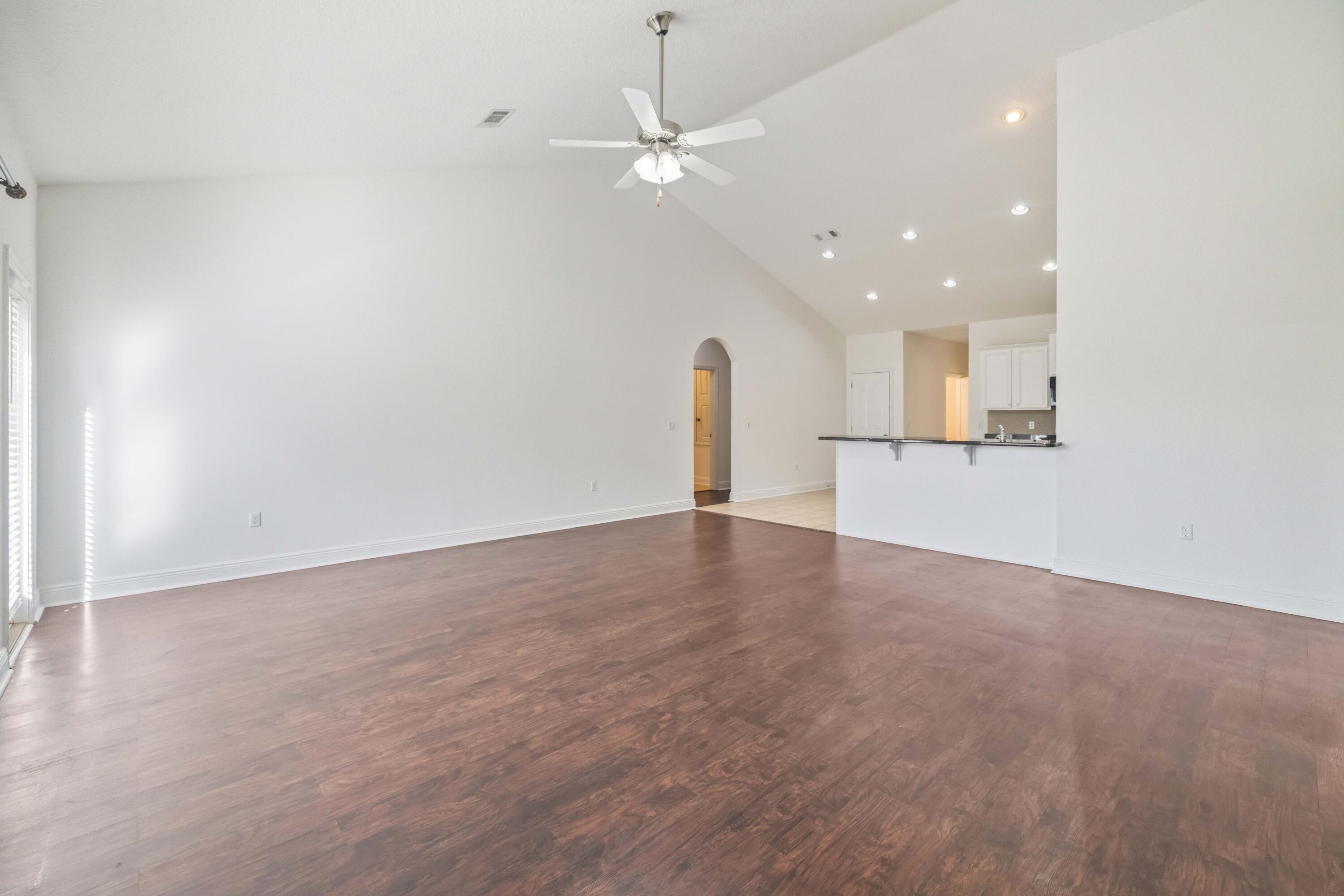 337 Mango Lane Freeport, FL 32439 - Photo 15 of 35 a view of a kitchen with a sink and a refrigerator