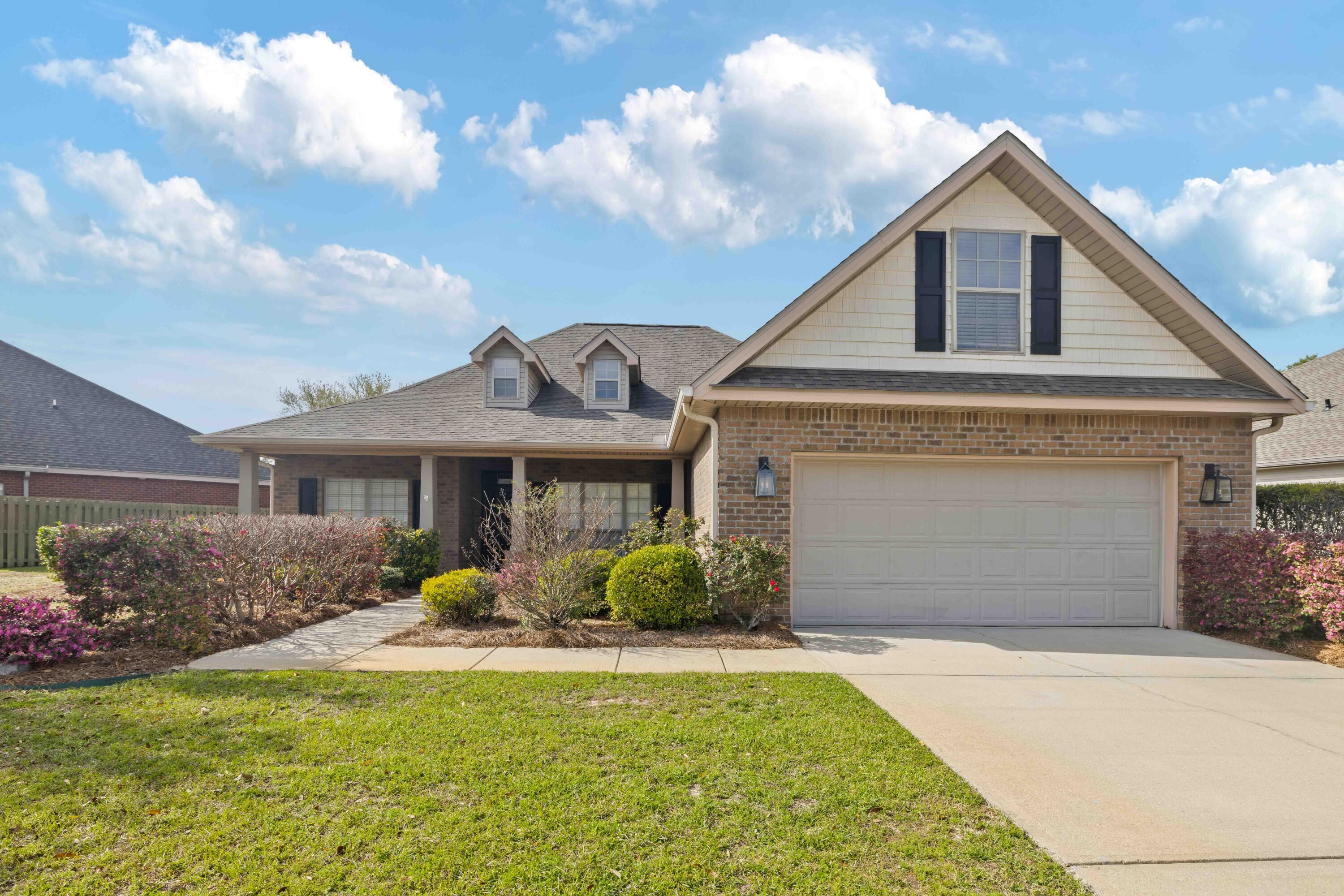 337 Mango Lane Freeport, FL 32439 - Photo 2 of 35 a front view of a house with garden