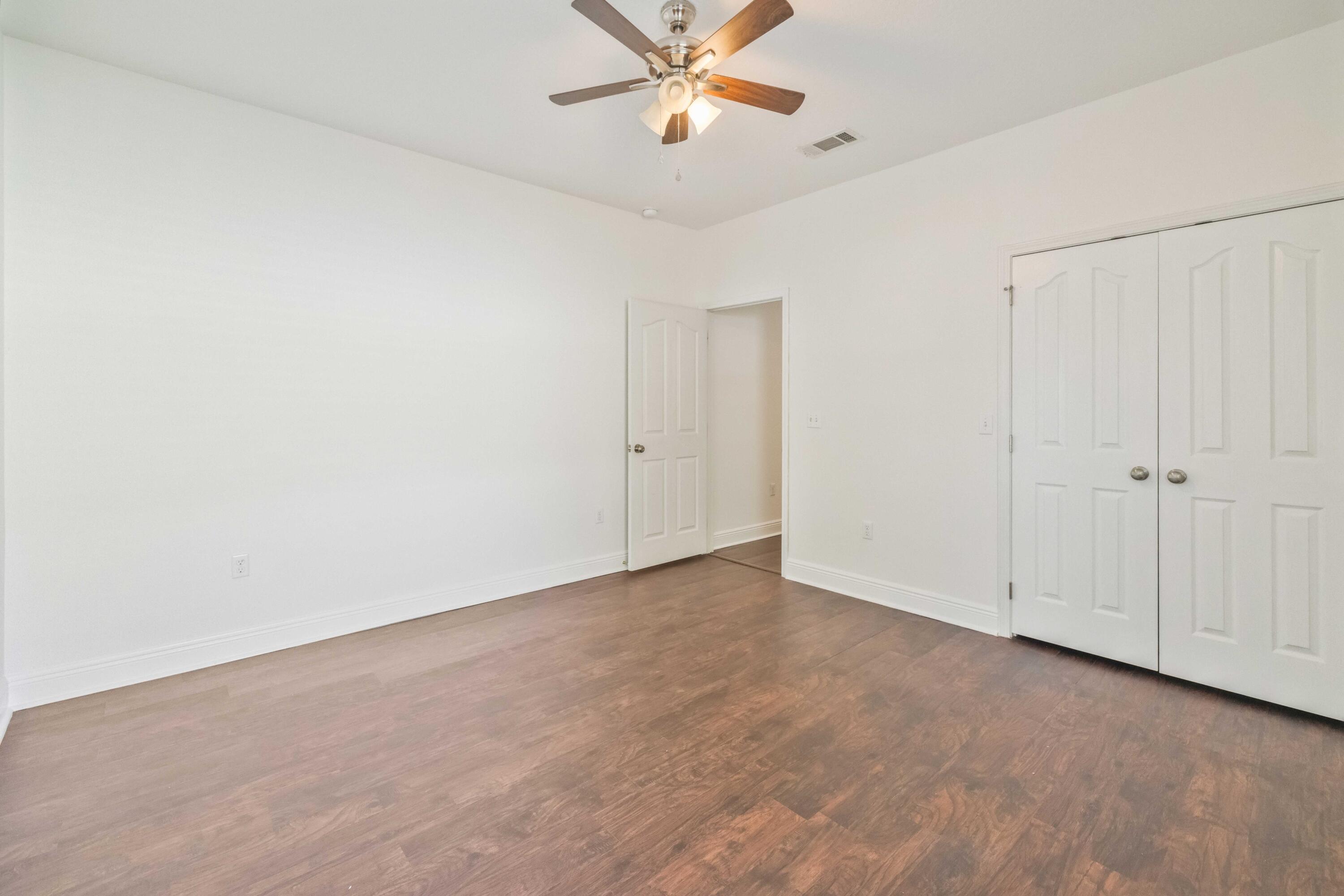 337 Mango Lane Freeport, FL 32439 - Photo 24 of 35 an empty room with closet and a ceiling fan