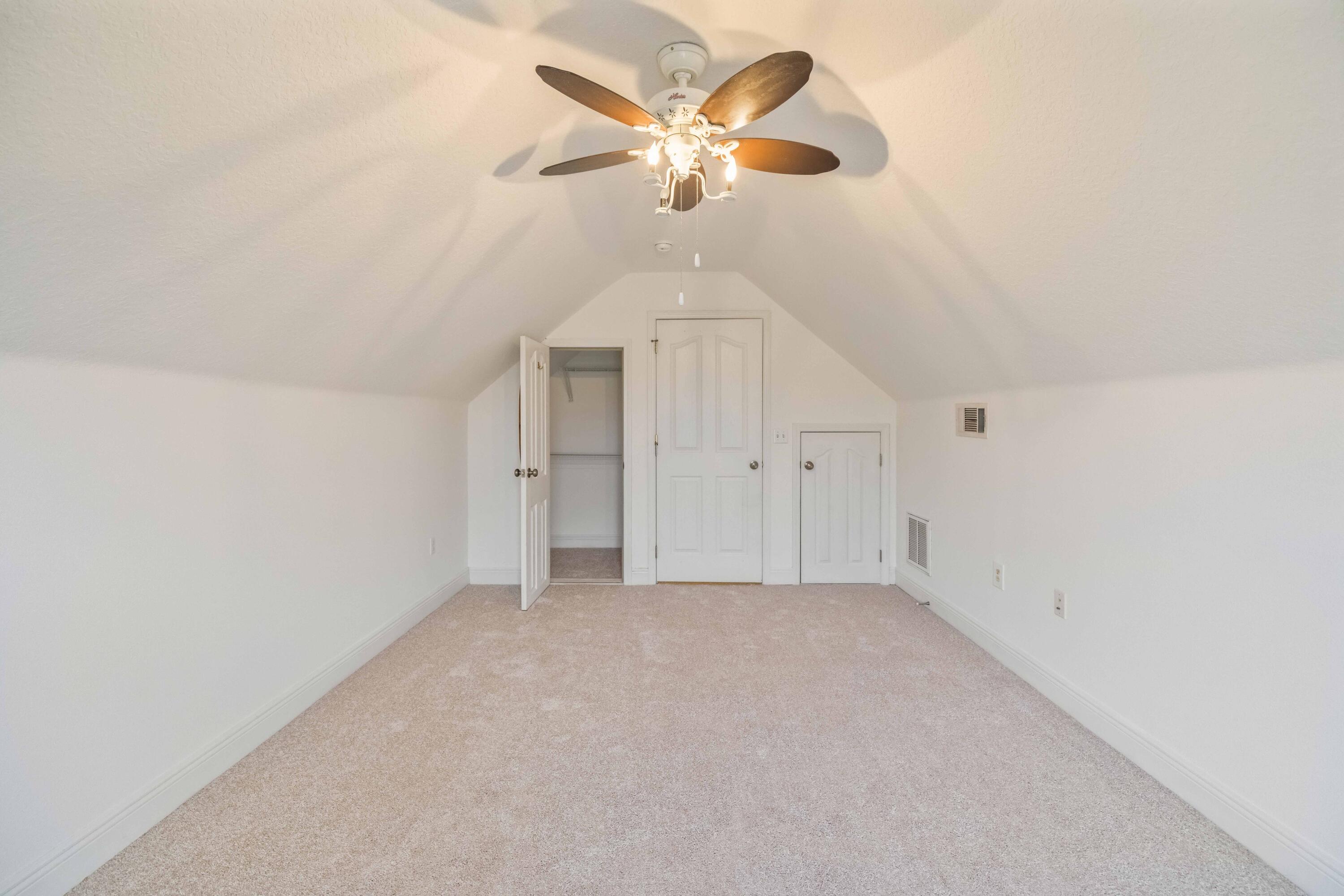 337 Mango Lane Freeport, FL 32439 - Photo 26 of 35 an empty room with chandelier fan