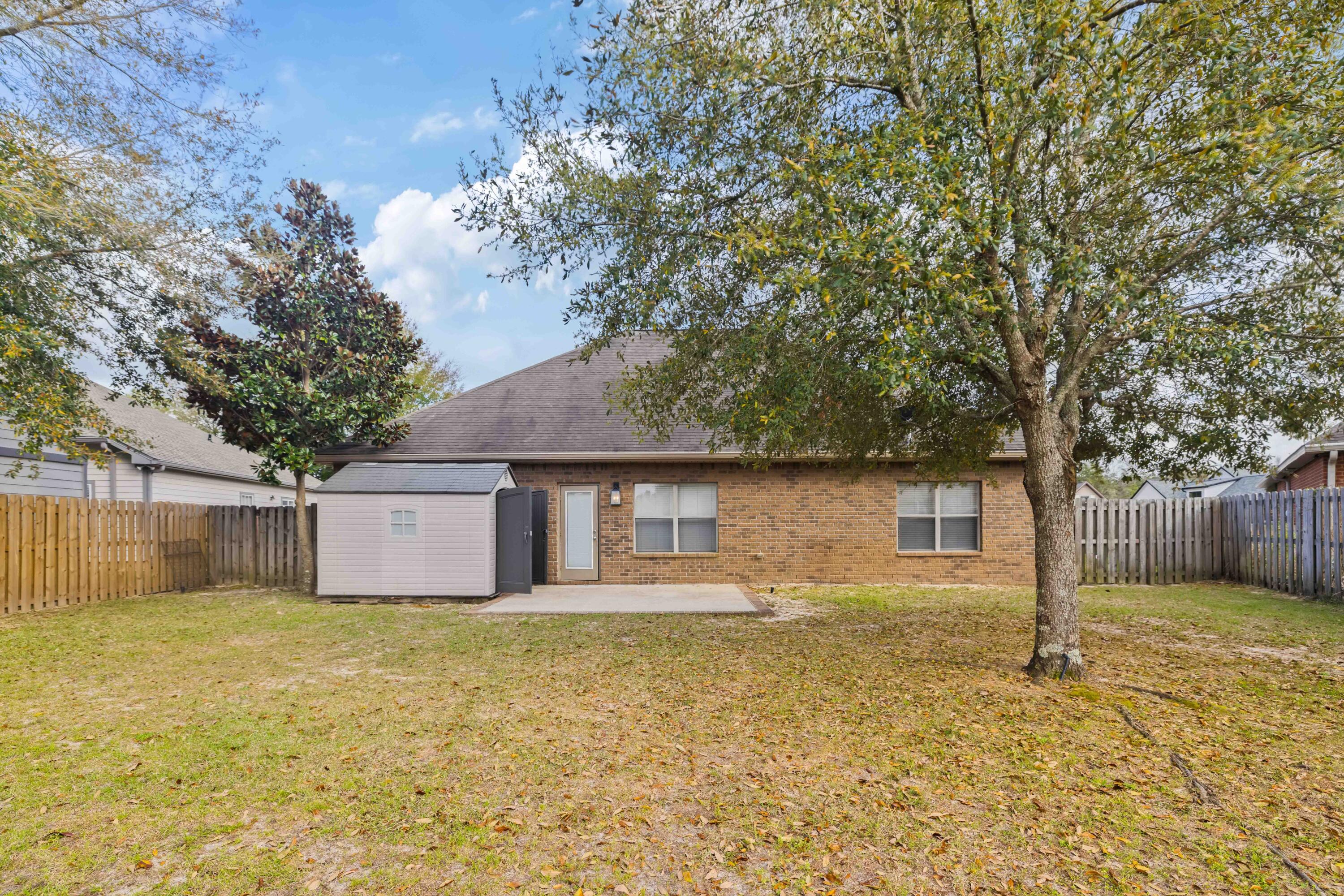 337 Mango Lane Freeport, FL 32439 - Photo 29 of 35 a view of a house with a yard