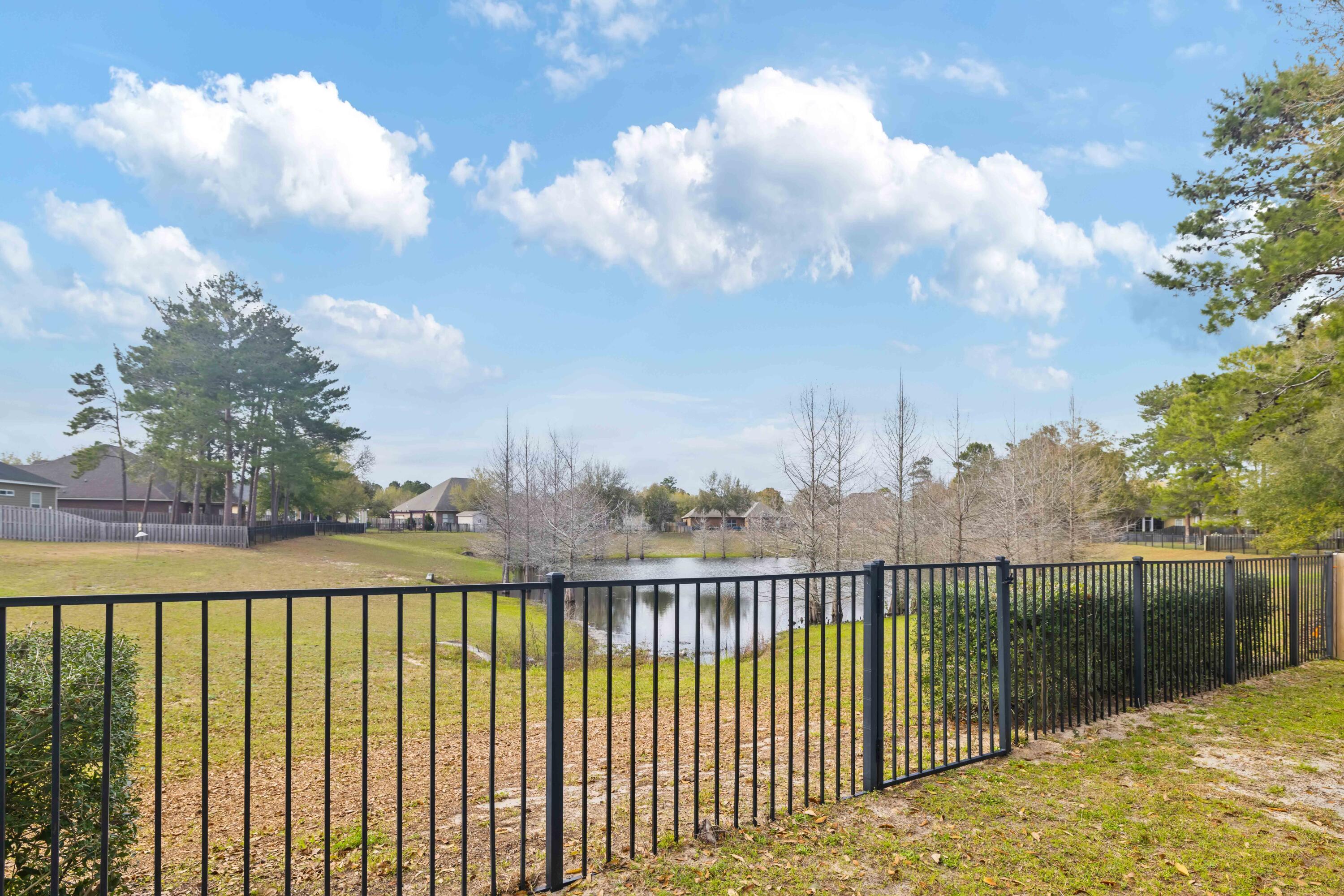 337 Mango Lane Freeport, FL 32439 - Photo 30 of 35 a view of a outdoor space with a lake view