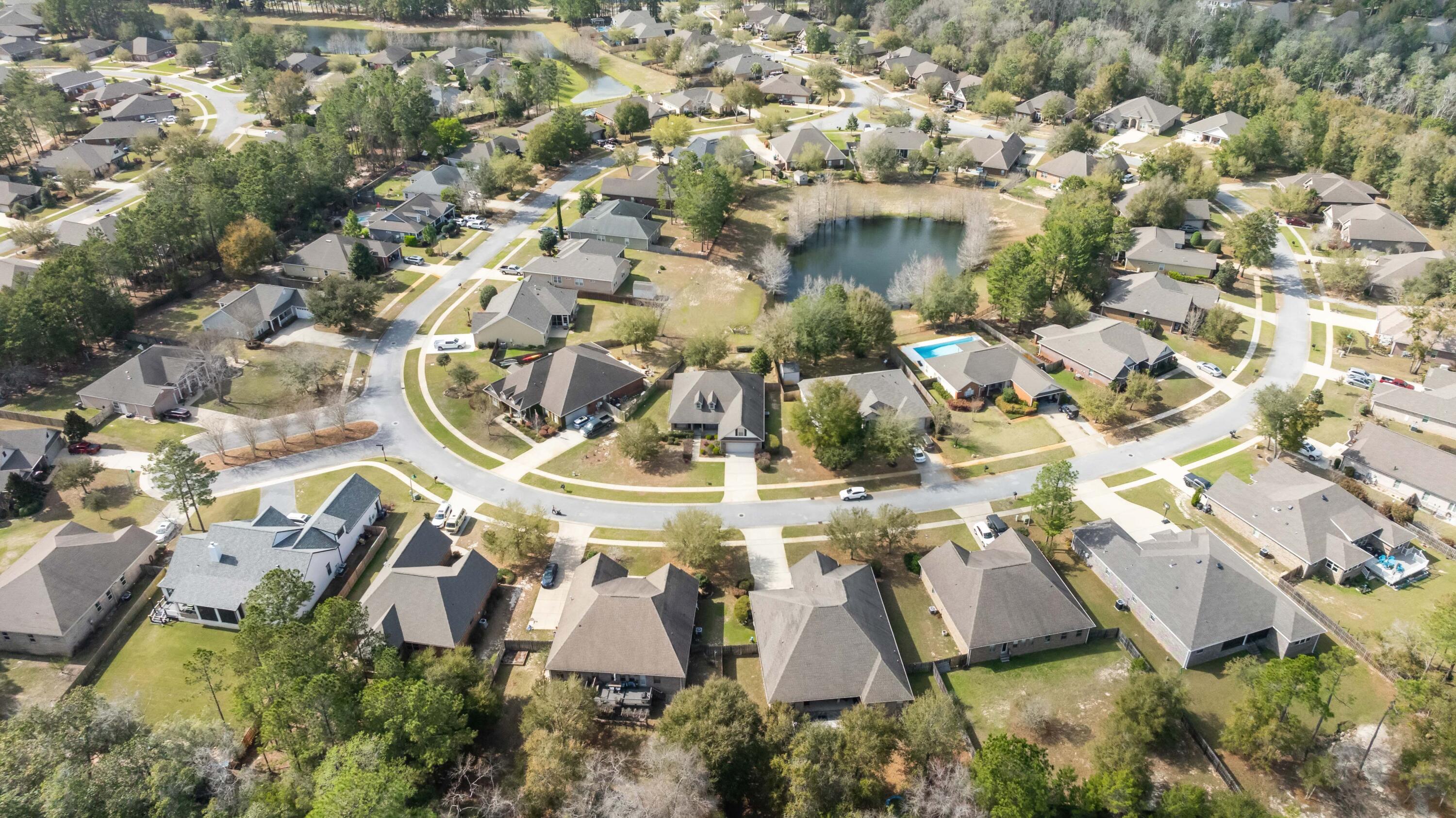 337 Mango Lane Freeport, FL 32439 - Photo 31 of 35 an aerial view of a house with swimming pool and large trees