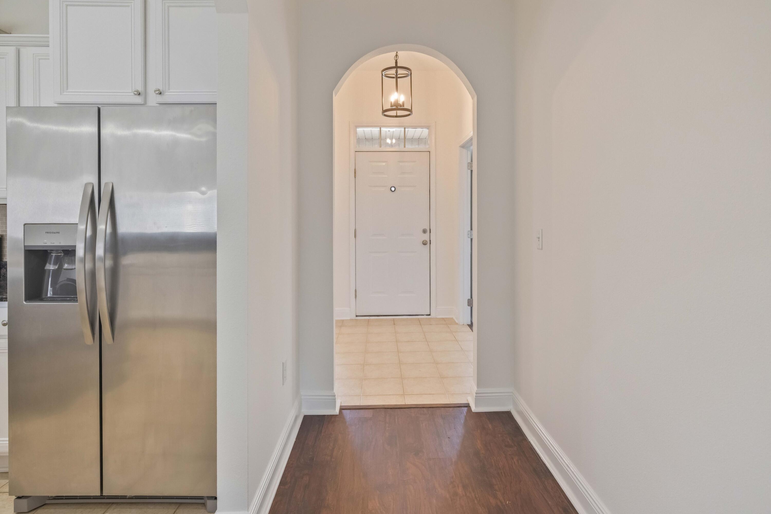 337 Mango Lane Freeport, FL 32439 - Photo 8 of 35 a view of hallway with wooden floor
