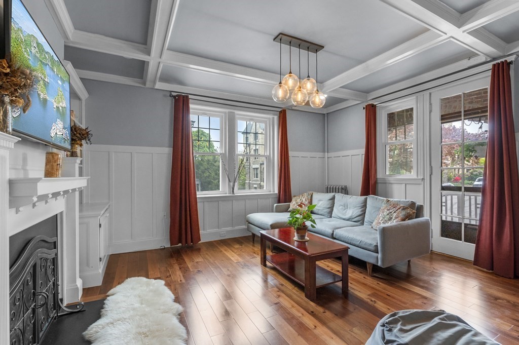 a living room with furniture fireplace and flat screen tv