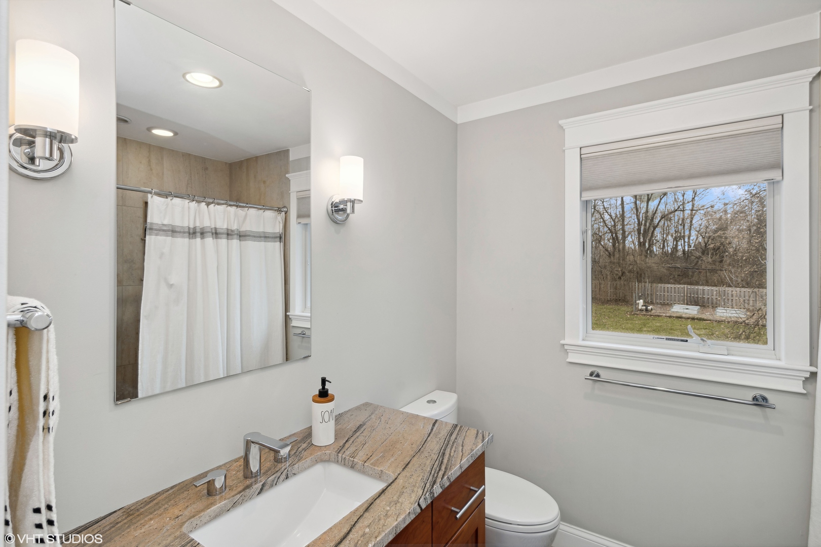 712 Surrey Lane Algonquin, IL 60102 - Photo 14 of 19 a bathroom with a granite countertop toilet a sink and mirror